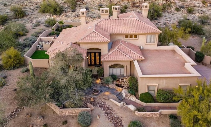 Mountain Park Ranch House | Enjoy breathtaking views of the mountainside throughout this hillside estate.