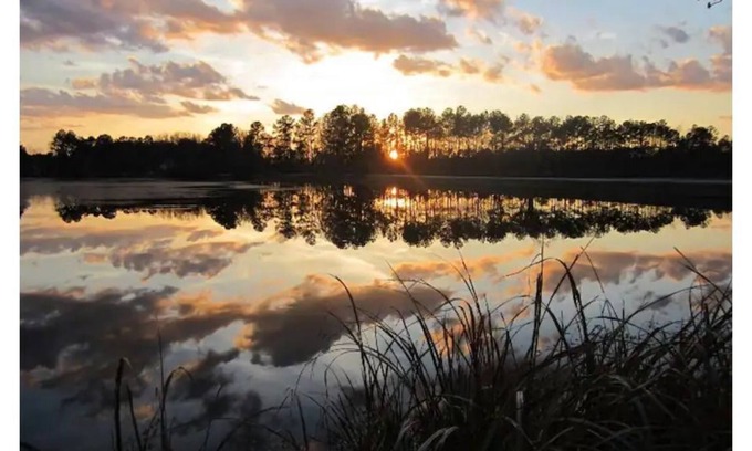 Cordesville House | Enjoy the sunrise on private dock on lake Haskie