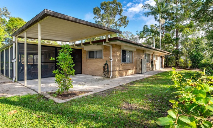 Tin Can Bay House | Enjoy the view and simply cross the road to the waters edge