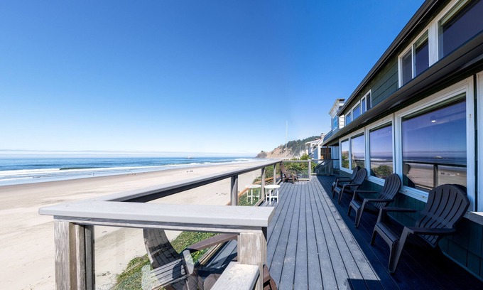 Roads End House | Enjoy the waves in the hot tub at this beachfront home with direct beach access