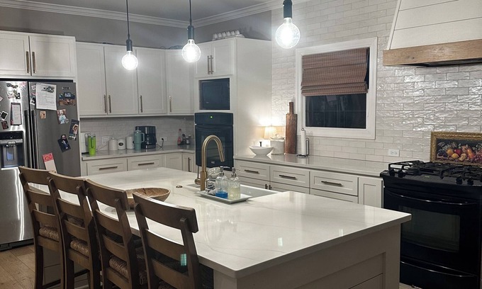 Oxford House | Escape to Serenity: Cozy Ranch Style Home with Charming Wrap-Around Porch.