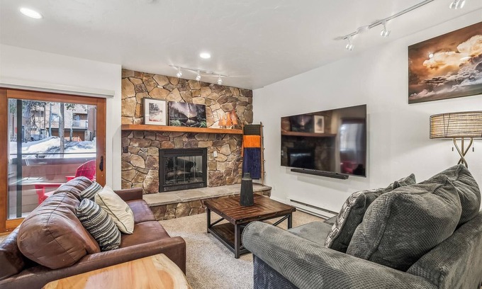 Four O'Clock Condo | Experience comfort at Sundowner II 201, featuring a cozy fireplace and easy ski access!