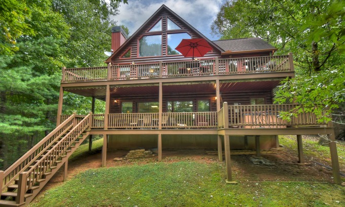 Walnut Mountain Cabin | Experience Lakeview Retreat, where pets are pampered by the shimmering waters. Unwind in a hot tub, enjoy WiFi, and a full game room w/pool table