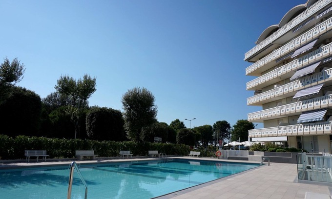 Porto Santa Margherita Apartment | Fantastic flat with shared pool for 5 guests