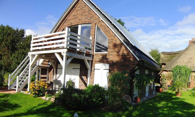Struckum Apartment | "Ferienhaus Wind" situated at the end of a cul-de-sac with a view over the marshes