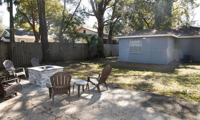Tampa Heights Apartment | Fire Pit Fenced Backyard Board Games