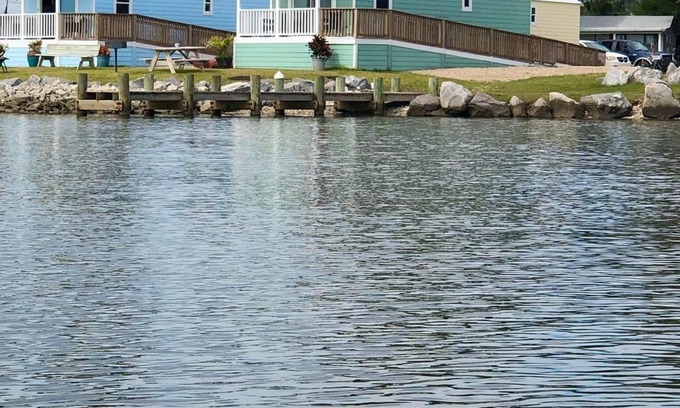 Eastpoint Cottage | (Fishing from dock) Boat launch, seafood market & bait-tackle shop next door.