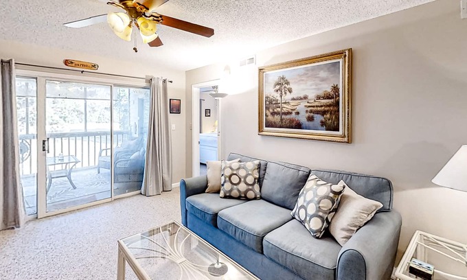 Colonial Charters Condo | Golf course community condo with fairway views, on-site pool, & balcony