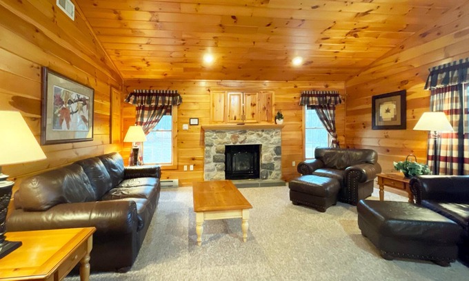Reeders Cabin | Gorgeous log cabin has a Big stone fireplace and a beautiful view of the lake