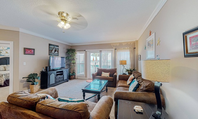 Mexico Beach Condo | Ground-floor condo with ocean view, pool/hot tub access, & private W/D