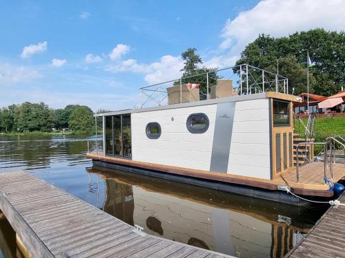Steinbild House | Hausboot Emsblick