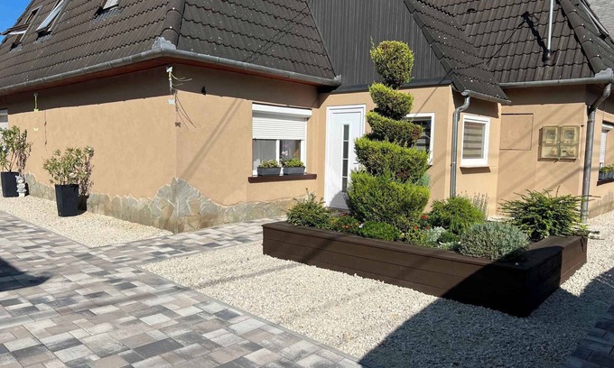 Siofok Apartment | Holiday apartment with garden, barbecue and children's playground in a quiet location