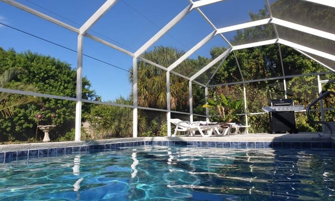Port Charlotte Villa | Holiday villa with an extra large heated private pool and terrace area