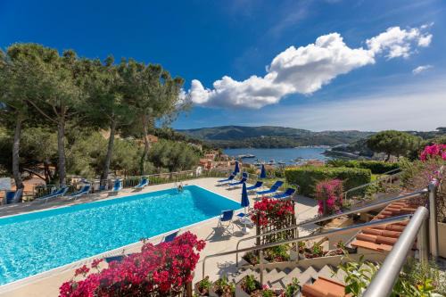 Porto Azzurro Apartment | Il Porto Bilocale 11 con piscina - Goelba