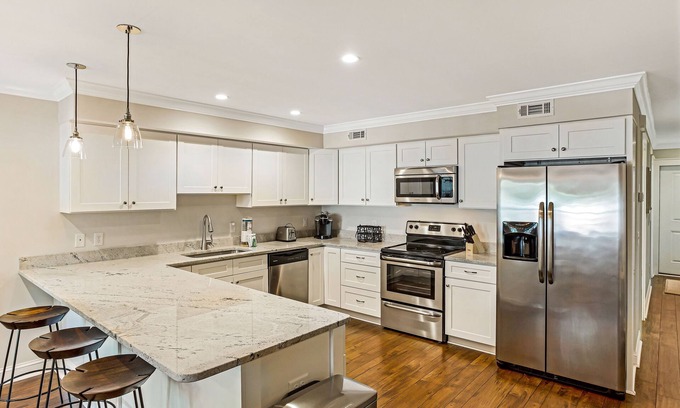 Historic Downtown Savannah Apartment | Inviting Garden Level Condo Near Forsyth Park by Lucky Savannah