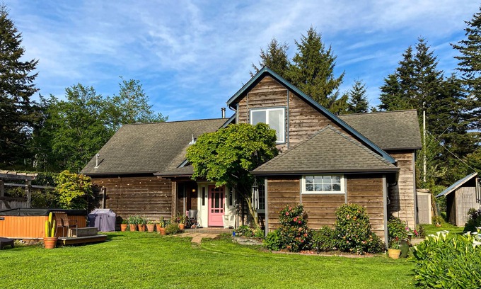 Westhaven-Moonstone House | Inviting home with water view, enclosed yard, hot tub, firepit, & W/D