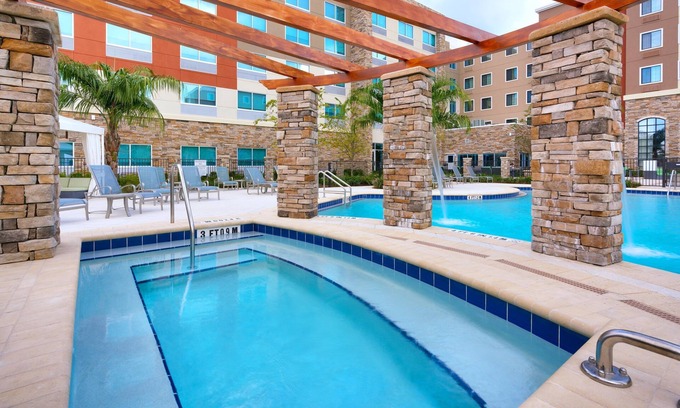 Gainesville Apartment | King Studio. Outdoor Pool & Hot Tub. Free Breakfast. Near U of Florida.