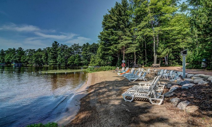 Eagle River Condo | Lake Forest Resort – Relax on a Pristine Sandy Beach in the Northwoods!