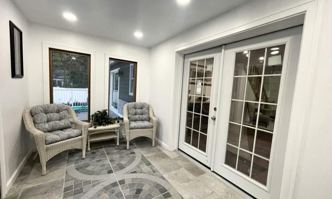 Racine House | Lake Michigan Retreat. Spacious 4-bedroom home on wooded lot across from lake.
