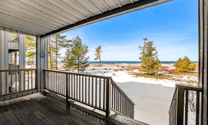 Glen Arbor Condo | Lakefront condo with deck, gorgeous view, fireplace, & W/D