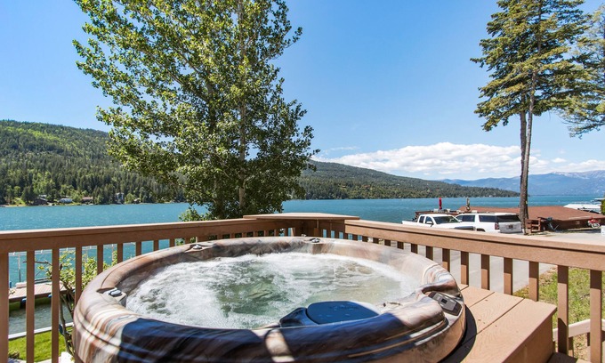 Sagle House | Lakefront home with tiki bar, private dock, hot tub, decks, fire pit, & kayaks