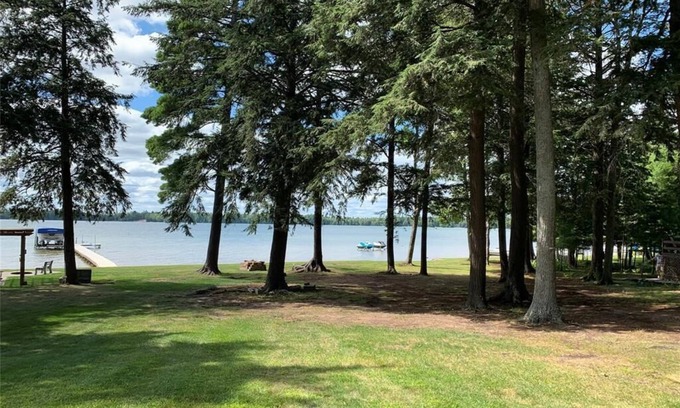 Grayling Cottage | Lakefront Oasis with Beach + Dock For Your Boat