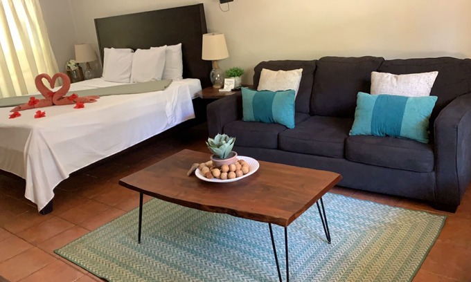 Antoneys Cay Cabin | Large suite with King bed. A kitchen area with sofa bed.