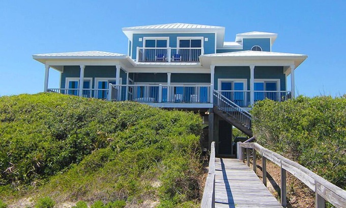 Sea Palm Village House | LEAVE YOUR WORRIES SURFSIDE. Take the private boardwalk and you're only steps from the beach.