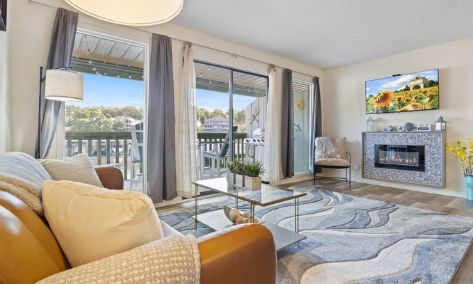 Village of Four Seasons Condo | Light filled condo with balcony, water views, grill & shared amenities