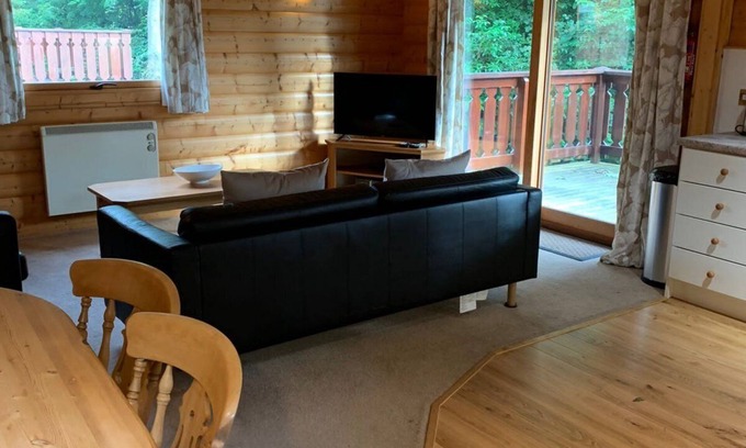 Louth Cabin | Log cabin with veranda, nestled in Kenwick Park, Louth
