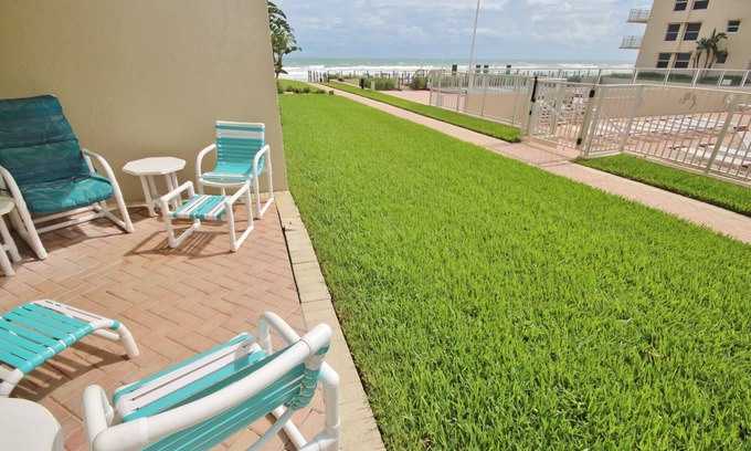 New Smyrna Beach Condo | Lovely Ground Floor Condo with Beautiful View of the Pool and Ocean