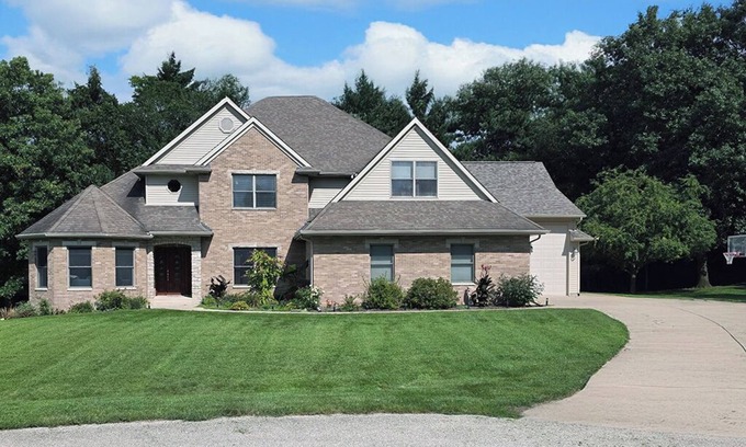 Geneseo House | Luxury 5 BR home on private wooded lot near QC, w/hot tub, rec & fitness room