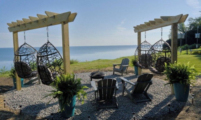 Ashtabula House | Luxury Lakefront Retreat: Panoramic Views, Game Room, Fire Pit Swings & More