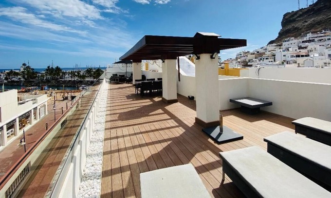 Playa de Mogan Apartment | Luxury penthouse in town center Puerto Mogan with ocean and beach views.