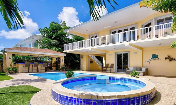 Twin Lakes House | Luxury Water Front Home, Private Pool, Spa, Tiki Bar, 37' Foot Dock with Kayaks