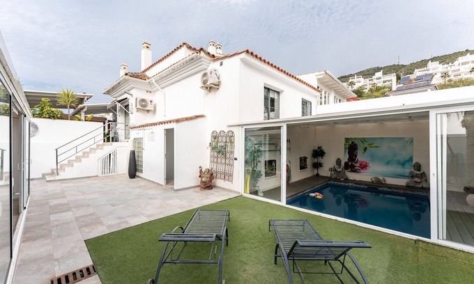 Benalmadena Ski Chalet | MalagaSuite Plumaria House