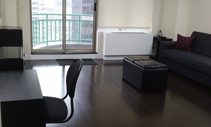 Turtle Bay Condo | MIDTOWN EAST APARTMENT ON HIGH FLOOR WITH BALCONY, 24HR DOORMEN, 5 STAR REVIEWS.