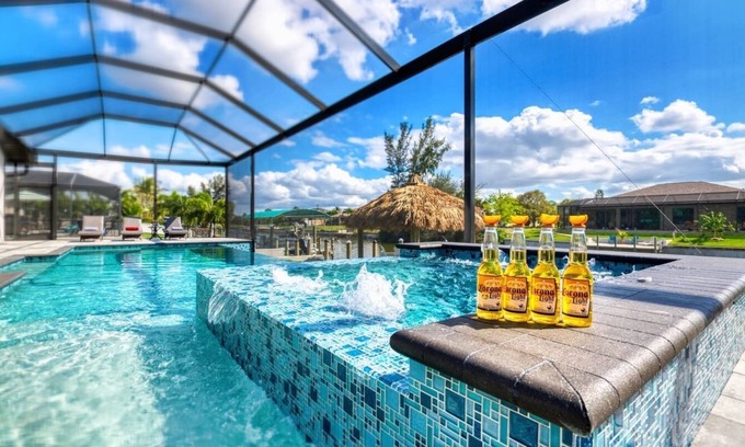 Pelican House | Modern Clean & Fully-Stocked Luxury Pool Home on Canal