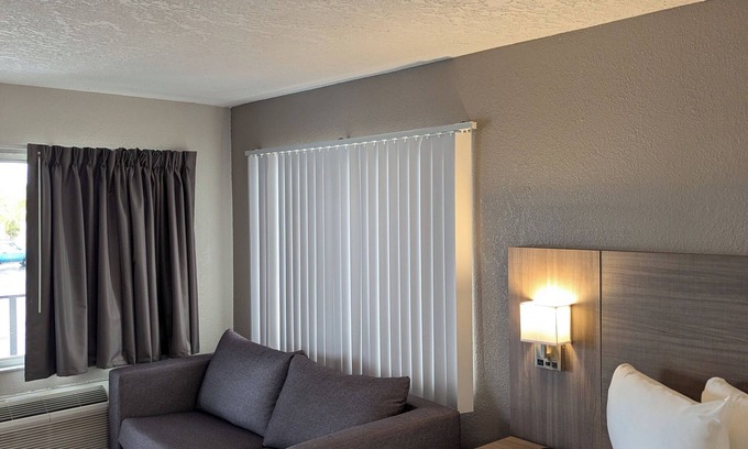 Kissimmee Apartment | Modern one-room apartment with updated amenities, including a full kitchen.