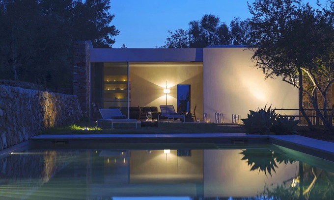 Santa Eulalia del Rio Villa | My Rental Homes - Villa Cave covered veranda with dining room and pool.