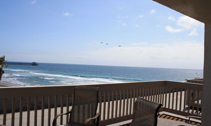 Townsite Condo | NCV D306 2BR 2BA 2-story Penthouse with breathtaking ocean, sand, & pier views.