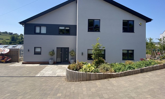 Liverton House | NEW DEVON HOME: estuary views, 5mins from beach, landscaped gardens, play area..