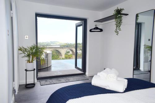Mabe Apartment | New Panoramic Riverview Apartment With Ev Plug