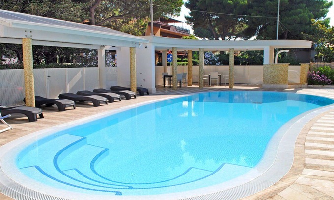 Latina Lido Apartment | Nice apartment for 5 guests with A/C, WIFI, pool, TV, balcony, pets allowed and parking