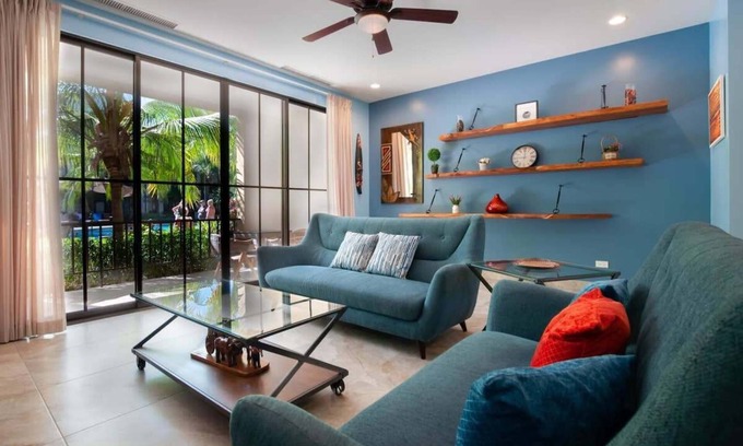 Coco Condo | Nicely decorated ground-floor unit in front of pool at Pacifico in Coco