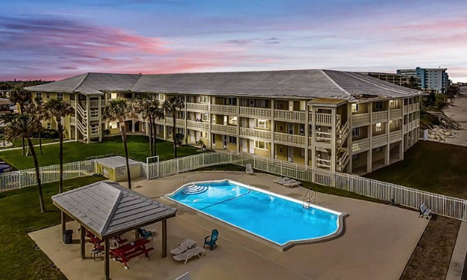 Satellite Beach Apartment | Ocean front apartment with pool, firepit, TV, & beach gear - snowbird friendly