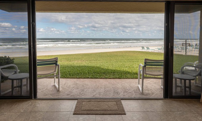 New Smyrna Beach Condo | Oceanfront Ground-Floor Retreat on No-Drive Beach | Peace & Comfort