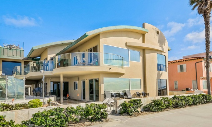 Central Mission Beach Condo | Oceanfront Surfrider windows to waves directly on the boardwalk with Hot Tub!