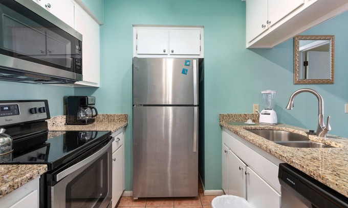 Saint Simons Island Condo | Oceanfront Condominium with Balcony, Pool and Boardwalk to Beach. Partial Ocean View