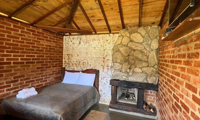 Senador Amaral House | Our cabin at the top of the property with verandah and veranda